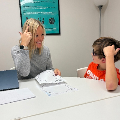 Comprehensive SLP's Jennifer Bennett working with a young client.